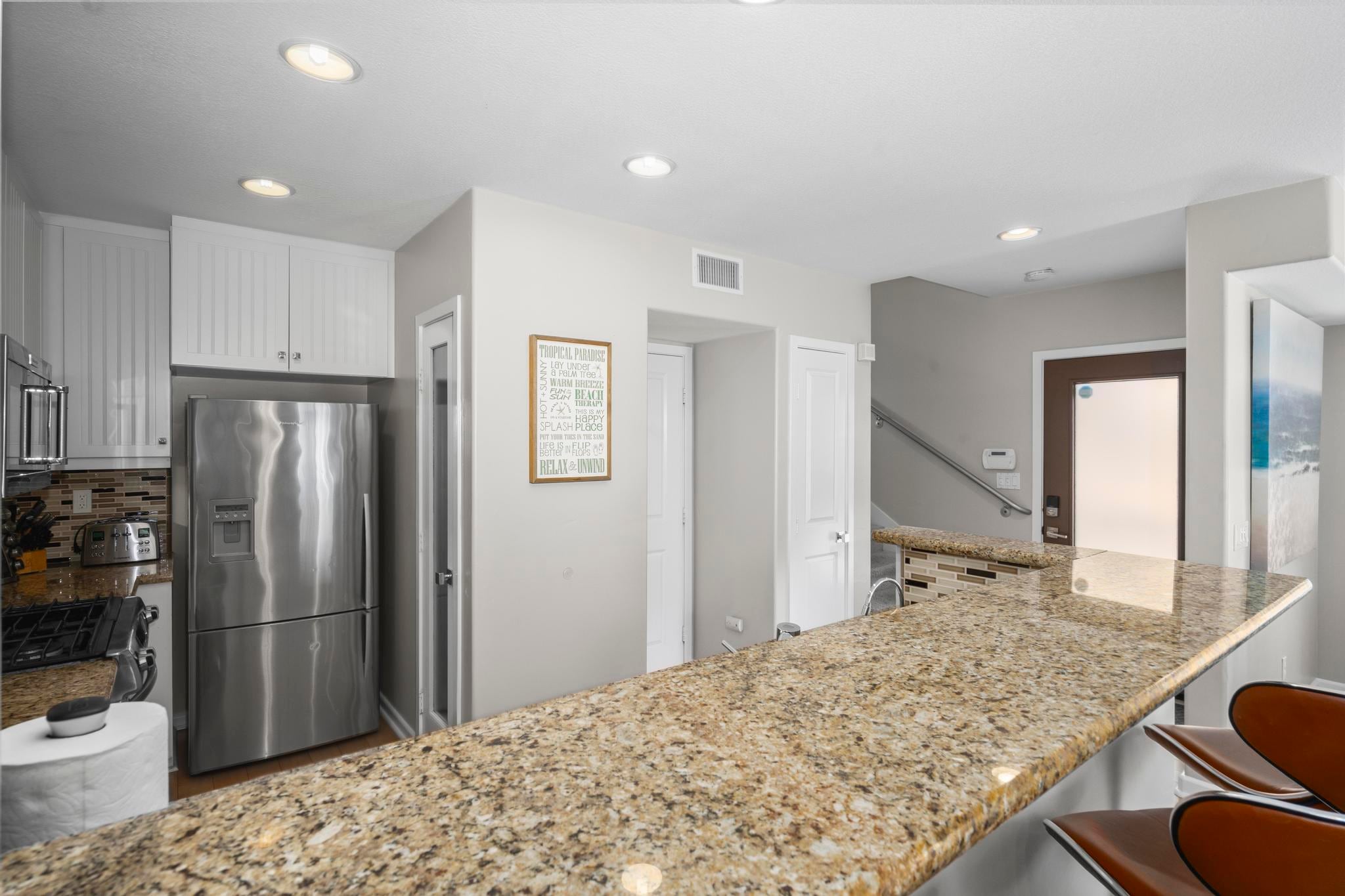 The kitchen counter at Belmont Beach House with bar seating